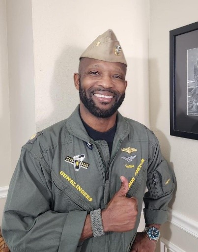 Ricardo "Tattoo" Foster, LCDR USN Ret., in flight suit
